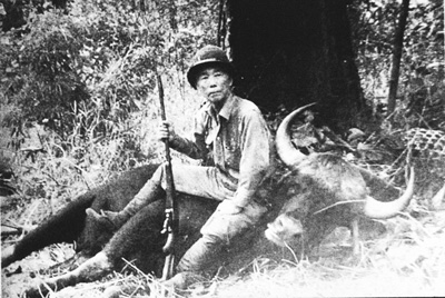 Tanaka sitting on buffalo