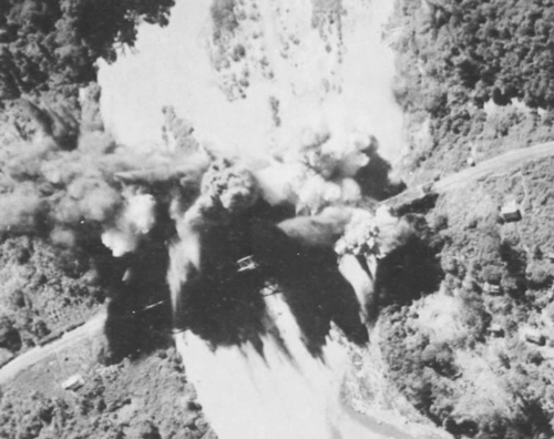 Closeup of bridge being bombed
